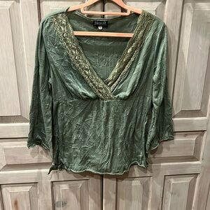 High waisted, 3/4 length sleeve, lace v-neck blouse.